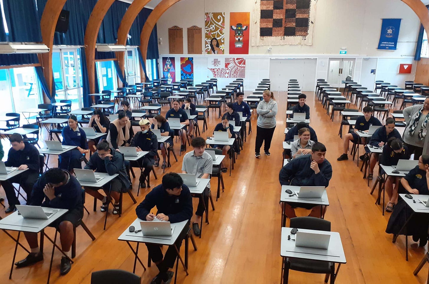 Classroom of students taking a digital assessment on laptops
